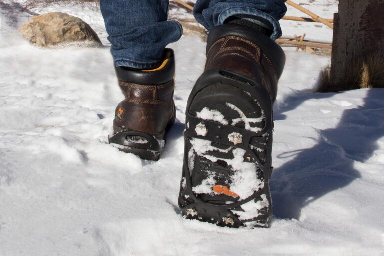Person walking through snow with SubZero Ice Cleats on boots