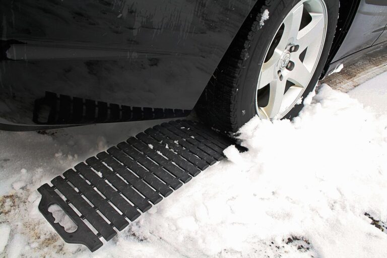 SubZero GripTrax Maxx Traction Tool placed behind vehicle tire in snow
