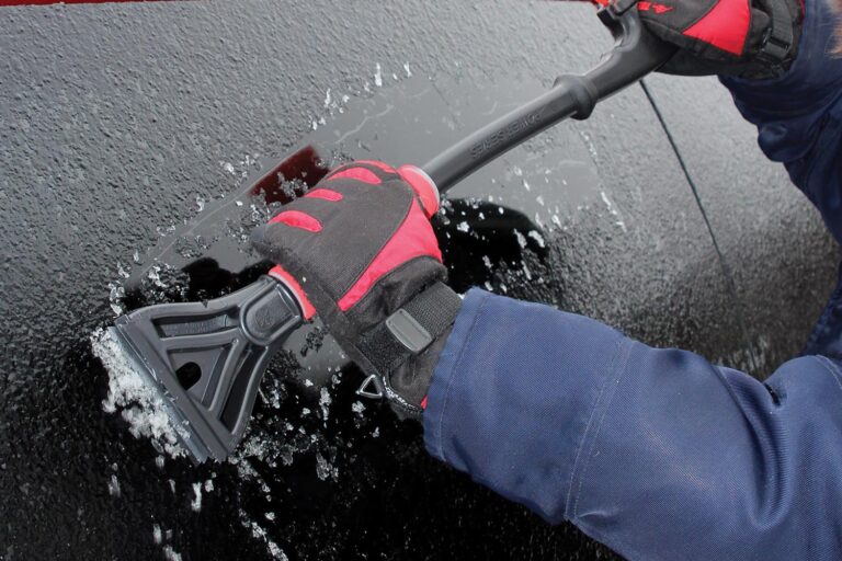 SubZero Power Series Snowbrush scraping ice from vehicle